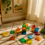 An assortment of colorful toys suitable for three-year-olds in a playroom.